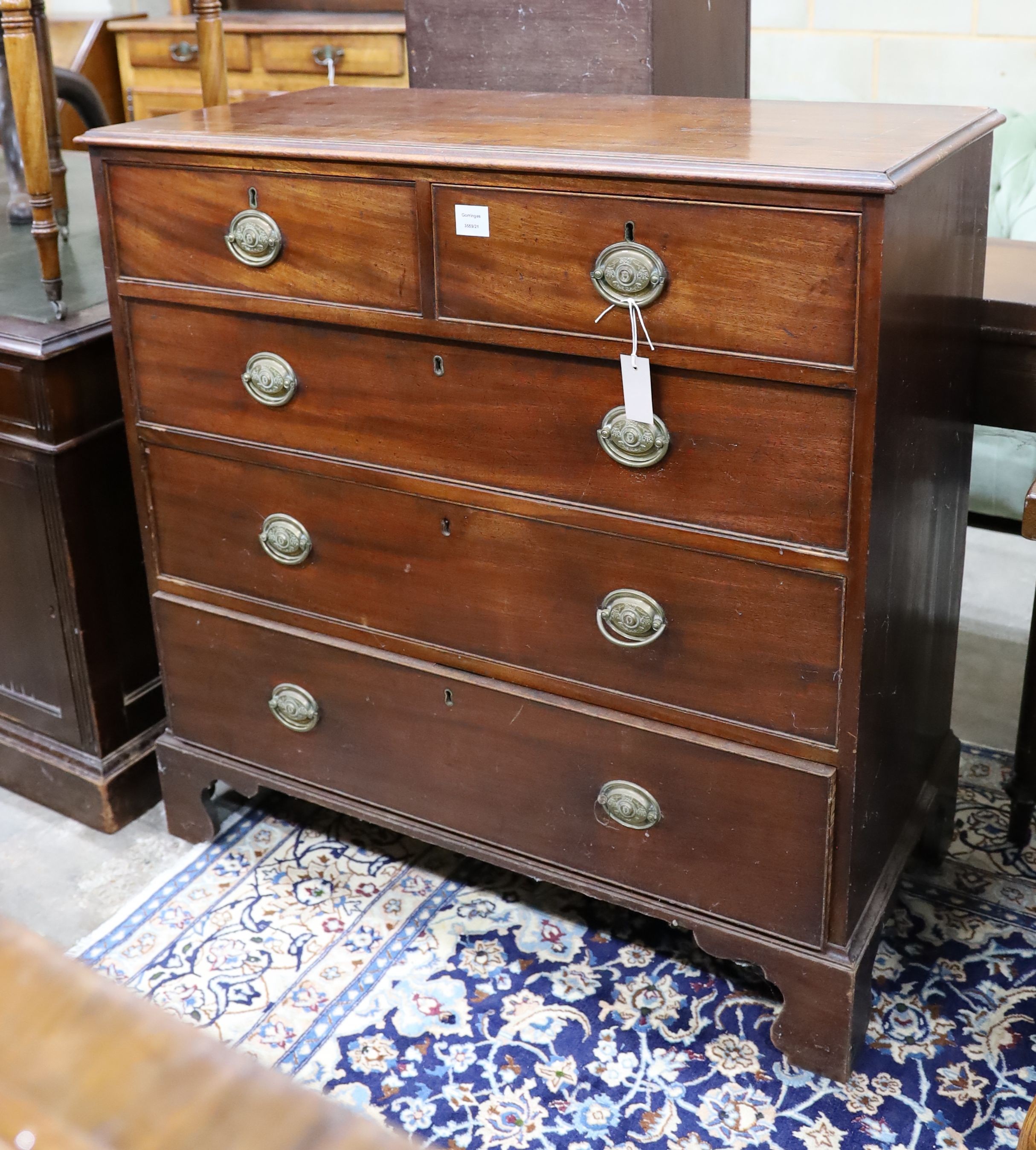 A George III mahogany straight front chest, fitted three long drawers and two short drawers, width 102cm, depth 49cm, height 102cm